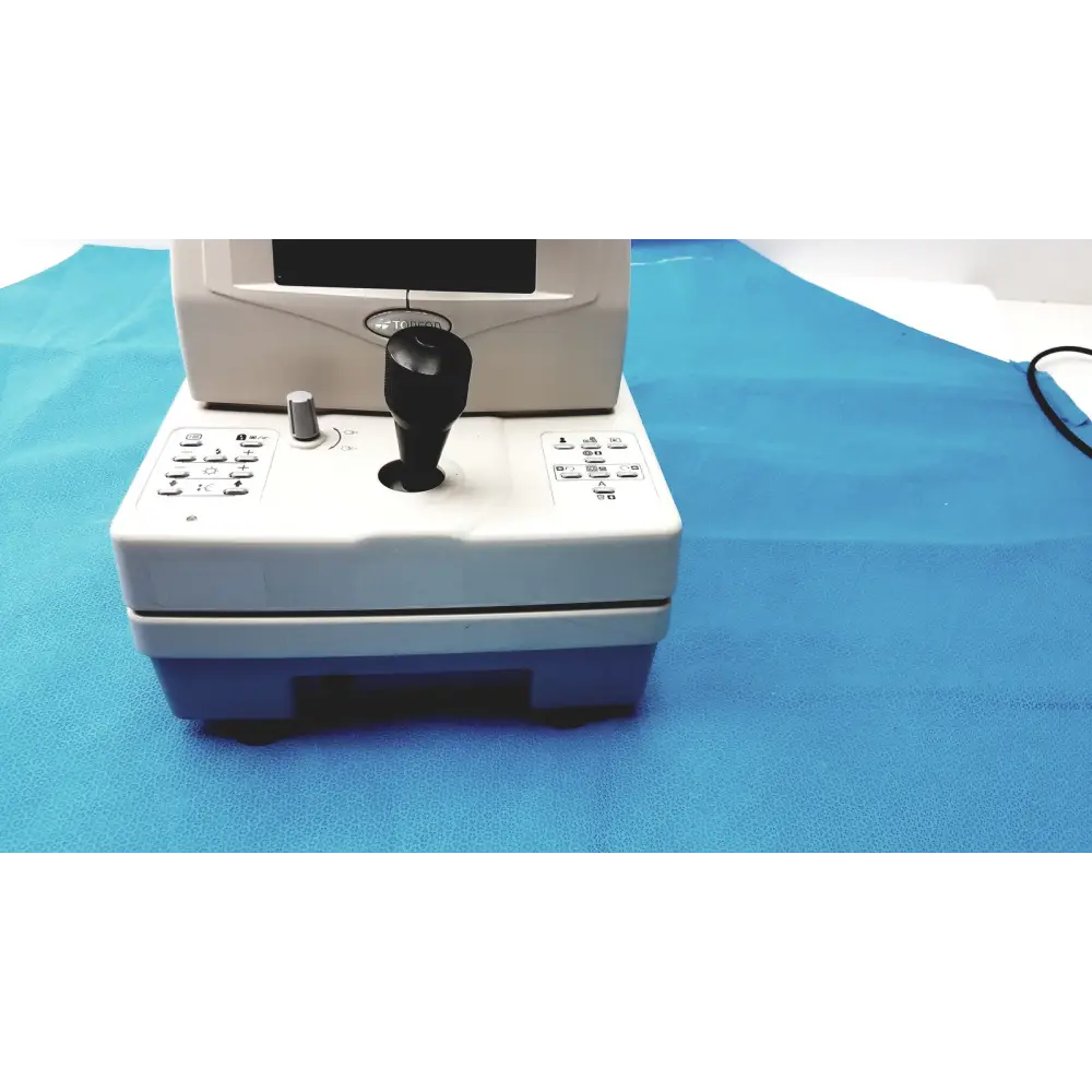 White and blue medical device with a black joystick, keypad buttons, and an integrated screen.