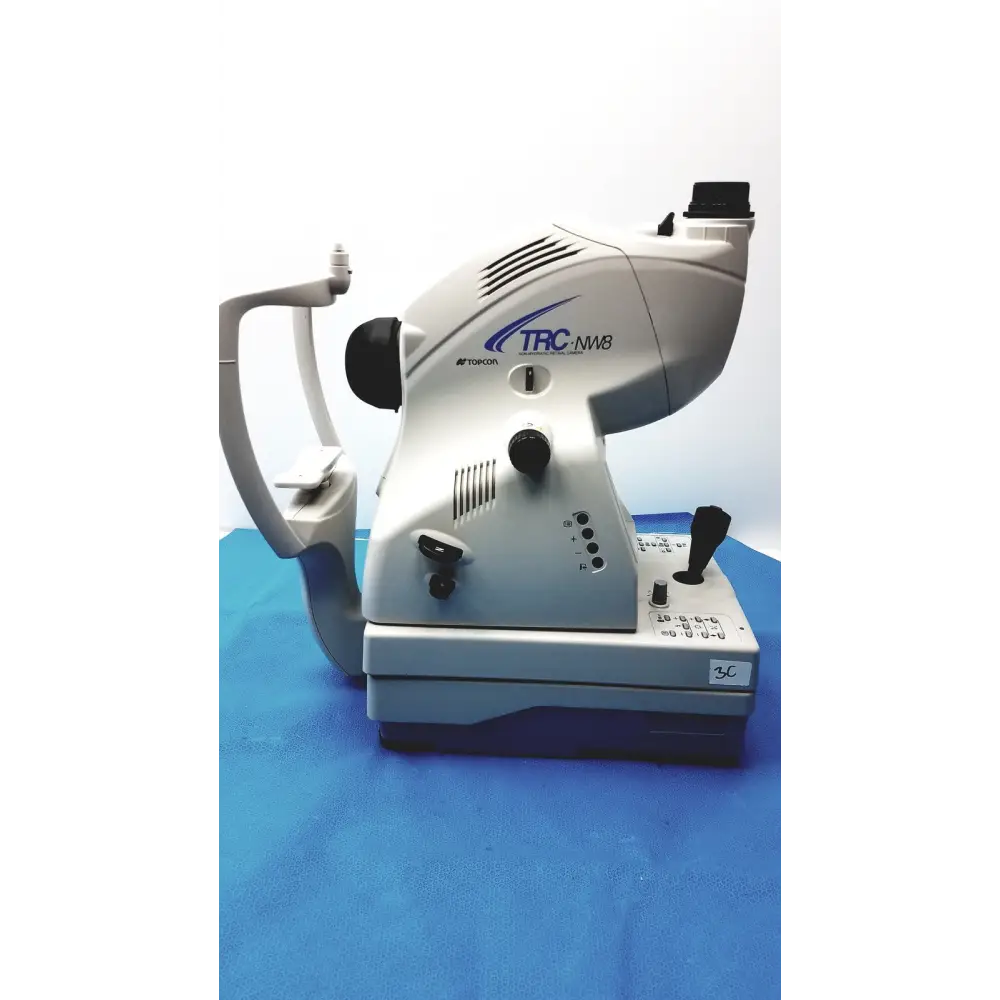 Silver and gray topcon trc-nw8 slit lamp biomicroscope with black control knobs and handles.