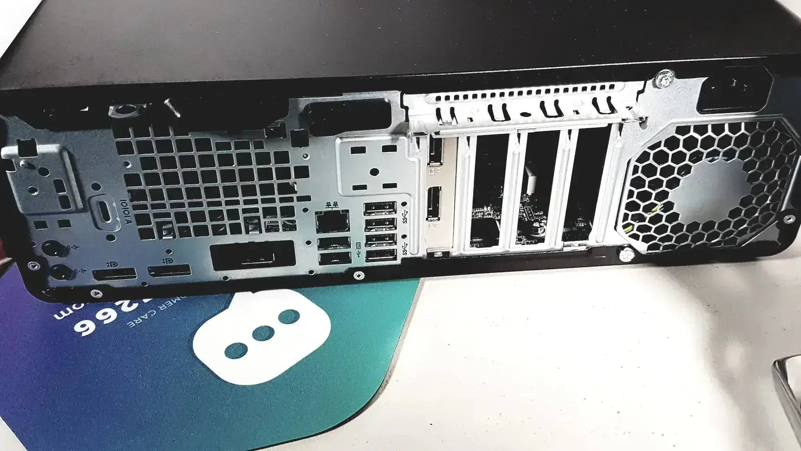 Black hp desktop computer with silver interior showing multiple ports and ventilation grilles for topcon trc nw8 retinal camera