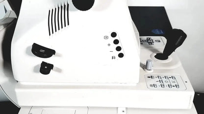 White topcon trc nw8 retinal camera with black control knobs, sleek modern design, and integrated computer and camera system
