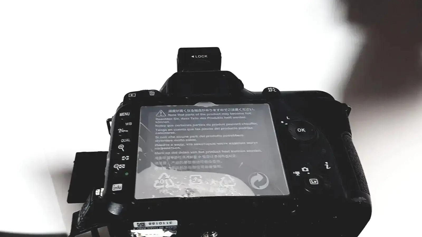 Black dslr camera with matte finish and control dials on top part of topcon trc nw8 retinal camera system