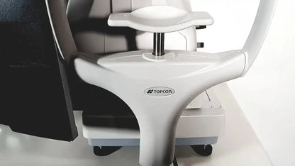 White plastic and metal topcon trc nw8 retinal camera with curved arm and adjustable headrest for eye examination