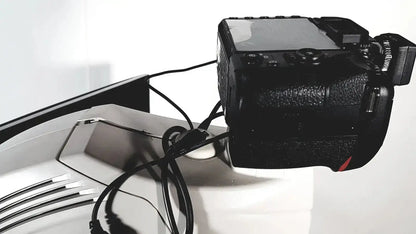 Black topcon trc nw8 retinal camera with textured grip and red accent designed for advanced eye imaging