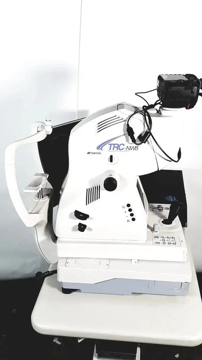 White Topcon TRC NW8 retinal camera slit lamp biomicroscope with black camera mounted for retinal imaging use