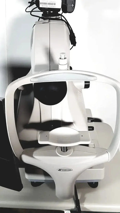 White topcon slit lamp biomicroscope with black accents featured in topcon trc nw8 retinal camera system