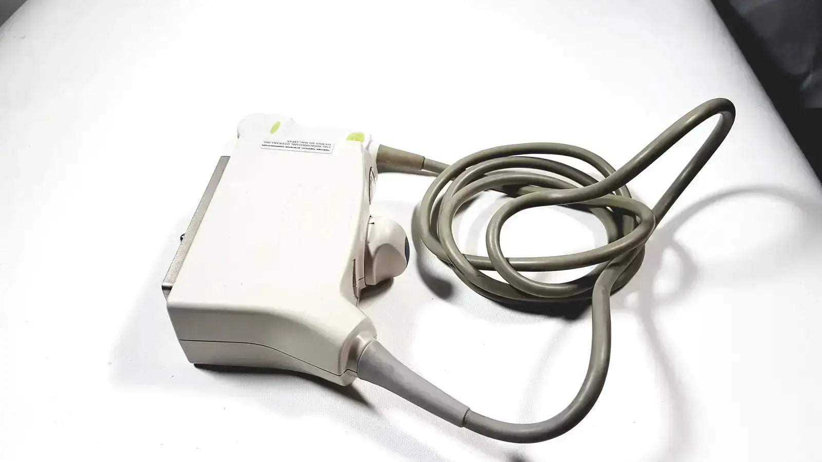 White toshiba PVT-382BT 3.5 MHz ultrasound transducer probe with coiled gray cable for medical imaging use