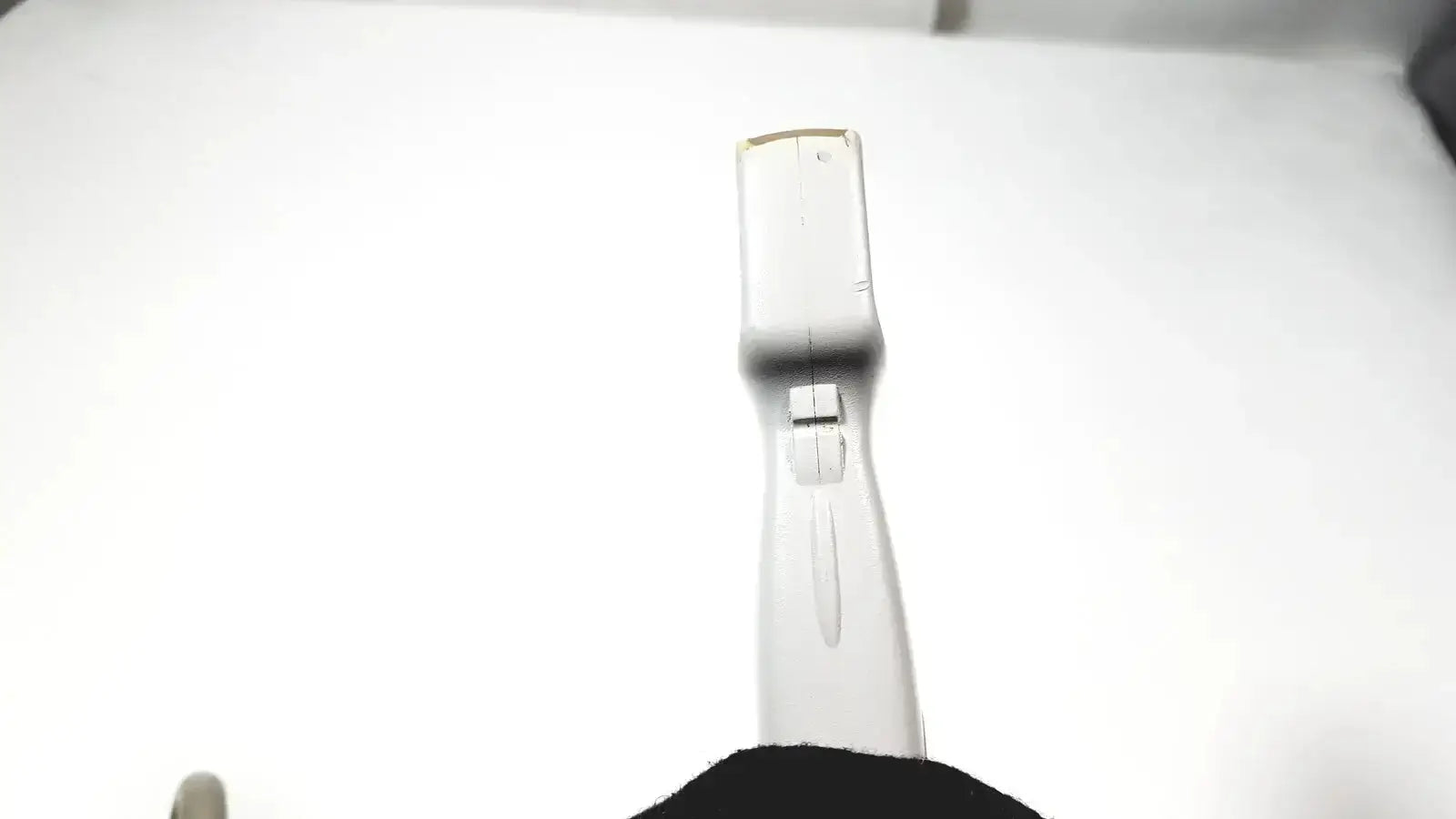 White plastic flip phone with rectangular screen and hinge mechanism used as a toshiba pvt-382bt ultrasound transducer probe