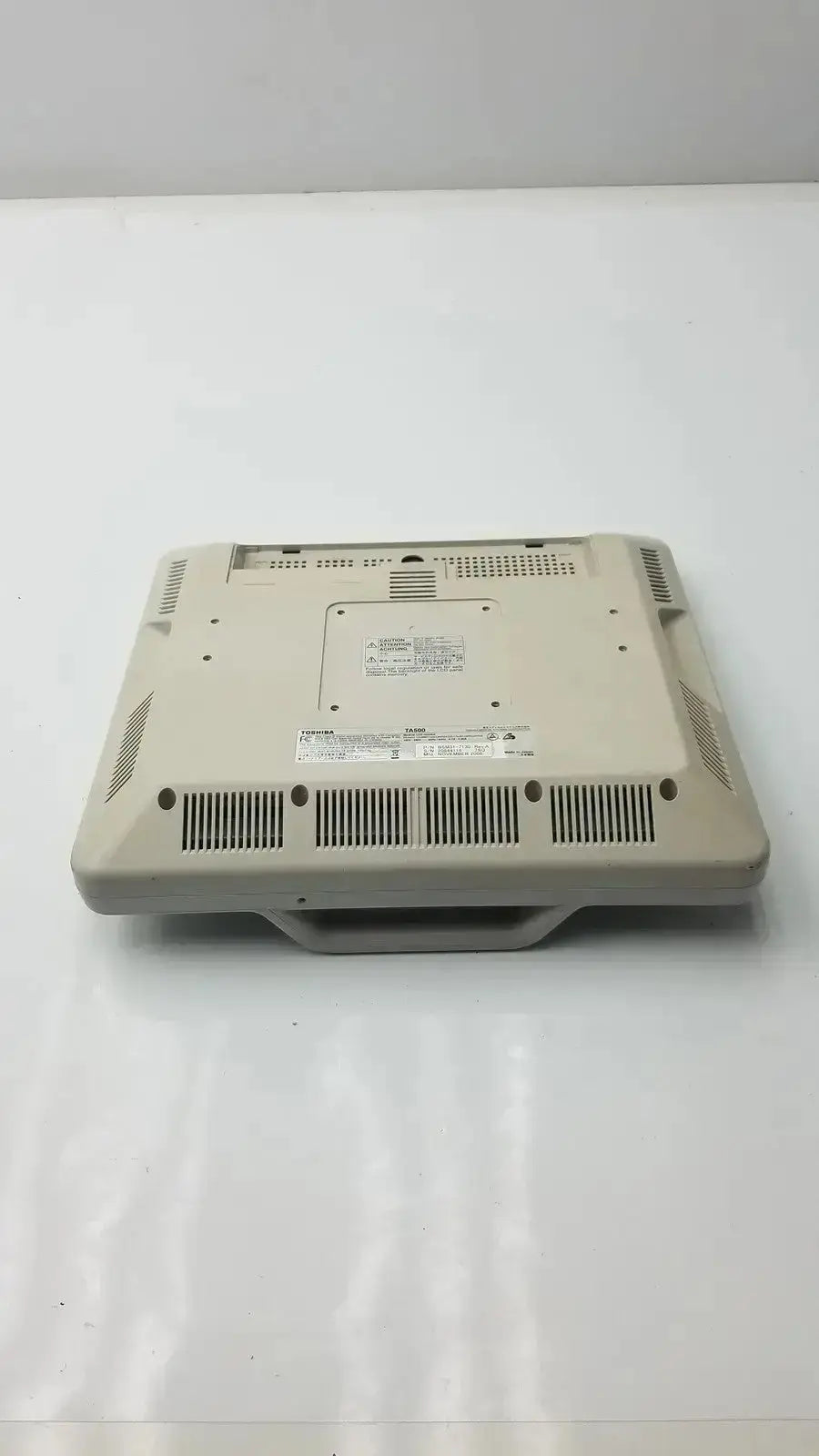 Beige plastic toshiba ta500 medical lcd monitor bsm31-7130 with integrated handle and ventilation grilles underside view
