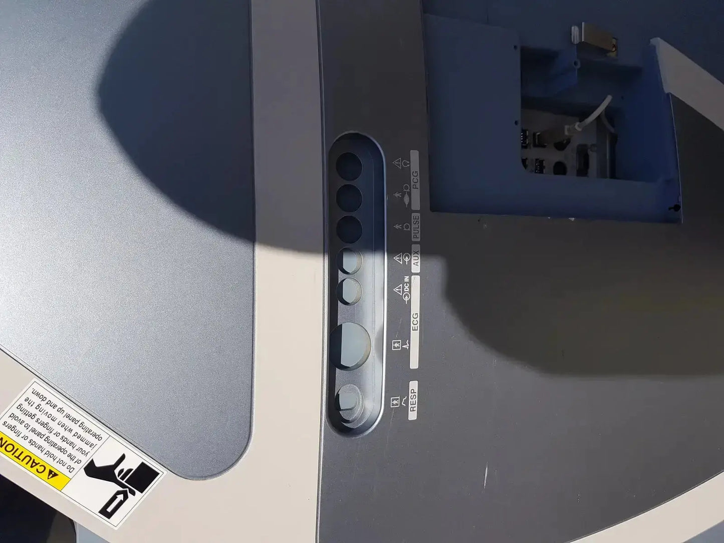 Gray plastic control panel with circular buttons and labeled functions on toshiba xario xg ssa-660a diagnostic ultrasound machine