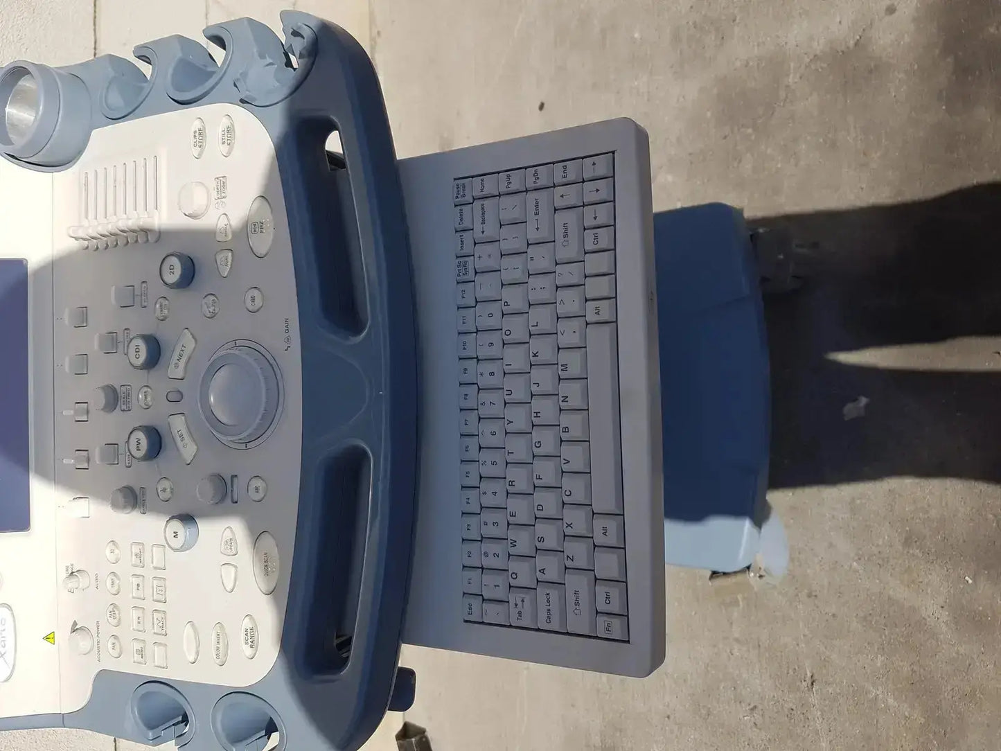 Blue and gray Toshiba Xario XG SSA-660A diagnostic ultrasound machine with built-in keyboard for diagnostic ultrasound use