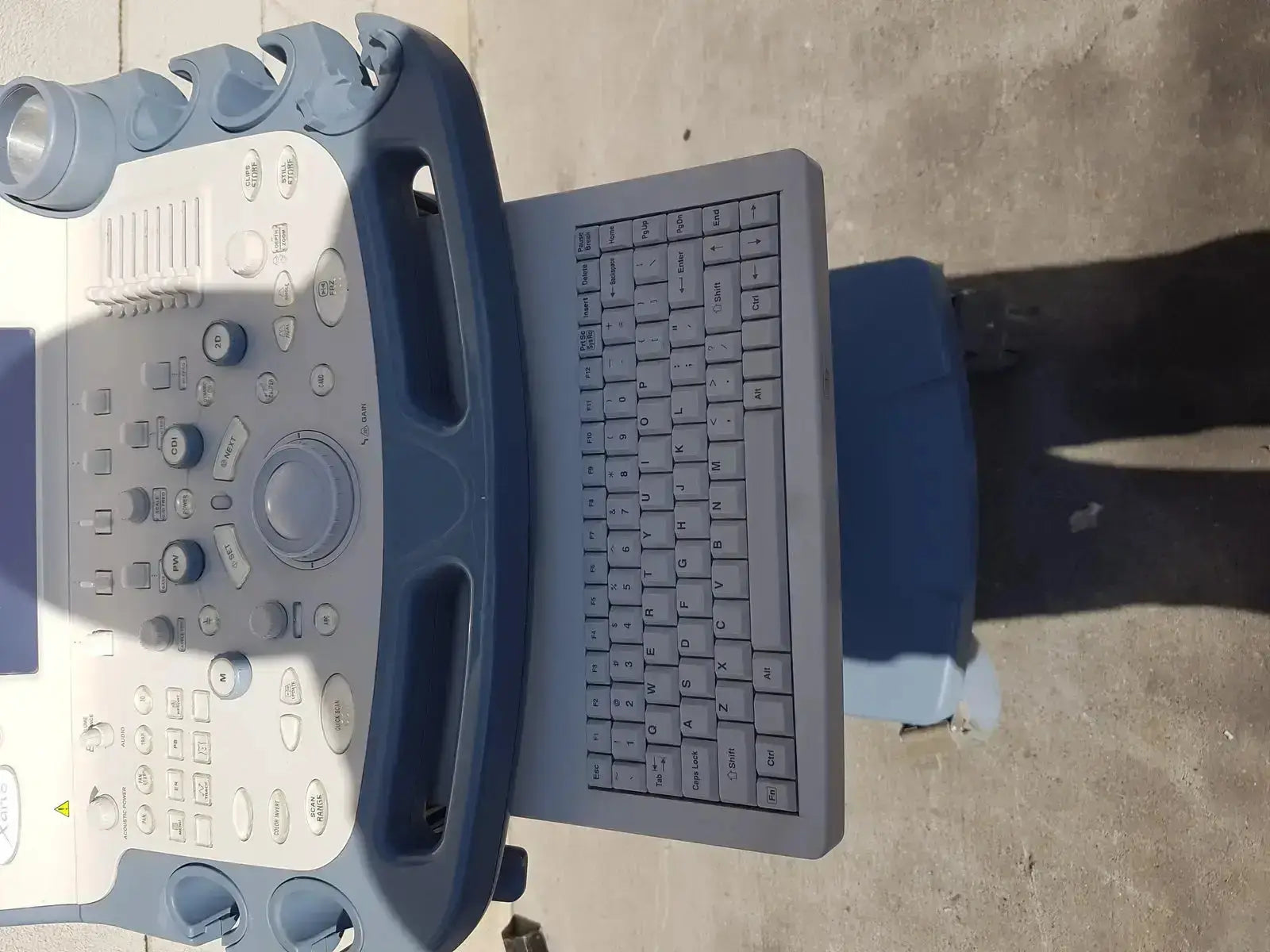 Blue and gray Toshiba Xario XG SSA-660A diagnostic ultrasound machine with built-in keyboard for diagnostic ultrasound use