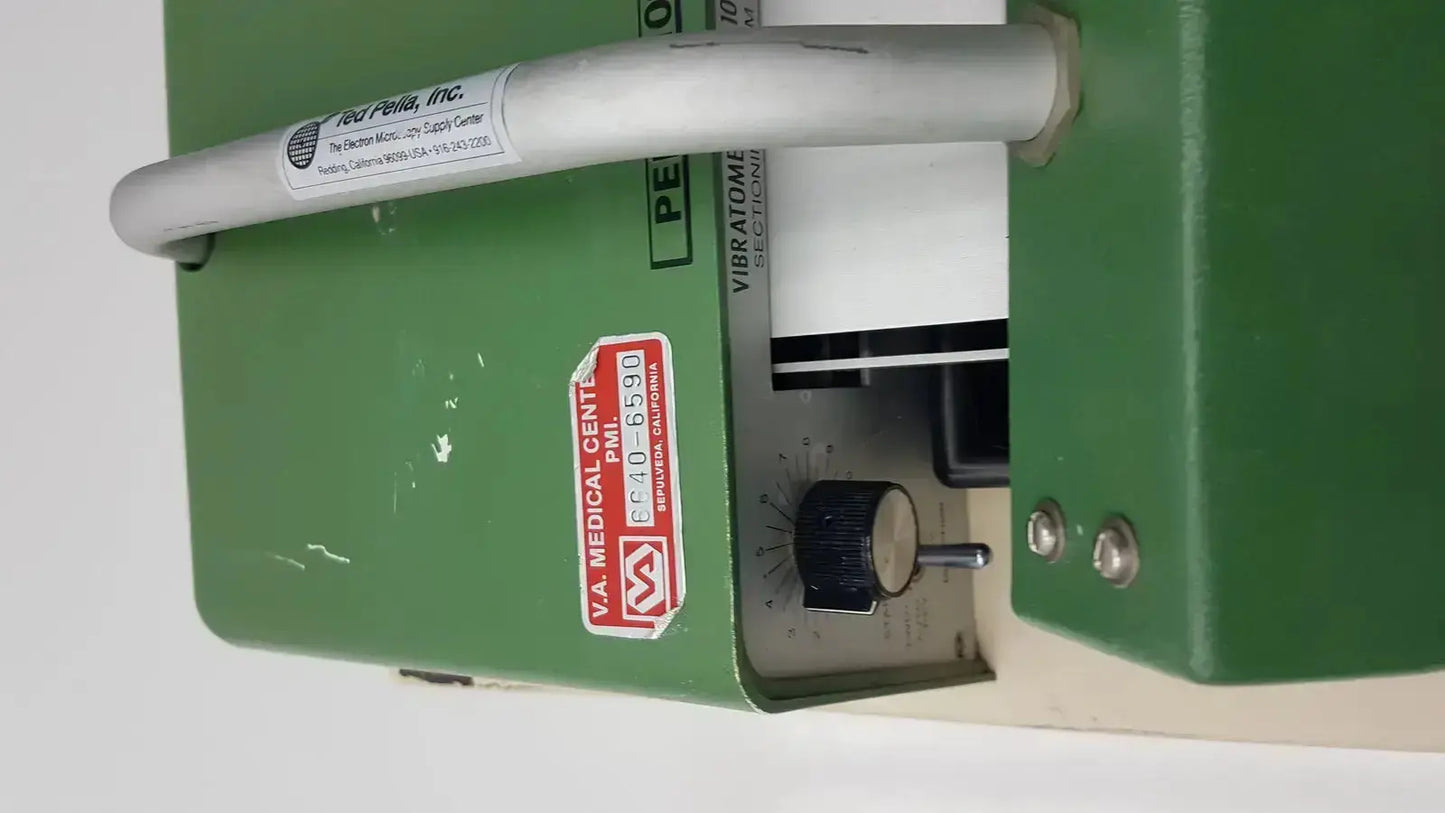 Green metal tpi vibratome series 1000 sectioning system with white cylindrical handle and control knob by pe medical center