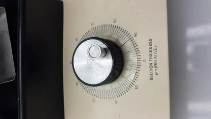 Beige-faced tpi vibratome series 1000 sectioning system with black and silver knob for adjusting section thickness