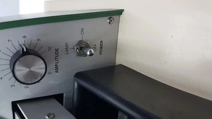 Silver amplitude knob with black dial and numbered markings on metallic panel with lamp power toggle for tpi vibratome series 1000