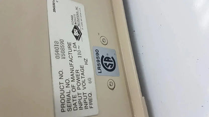 Beige industrial power supply unit with white technical label and silver srd certification on the back of tpi vibratome series 1000