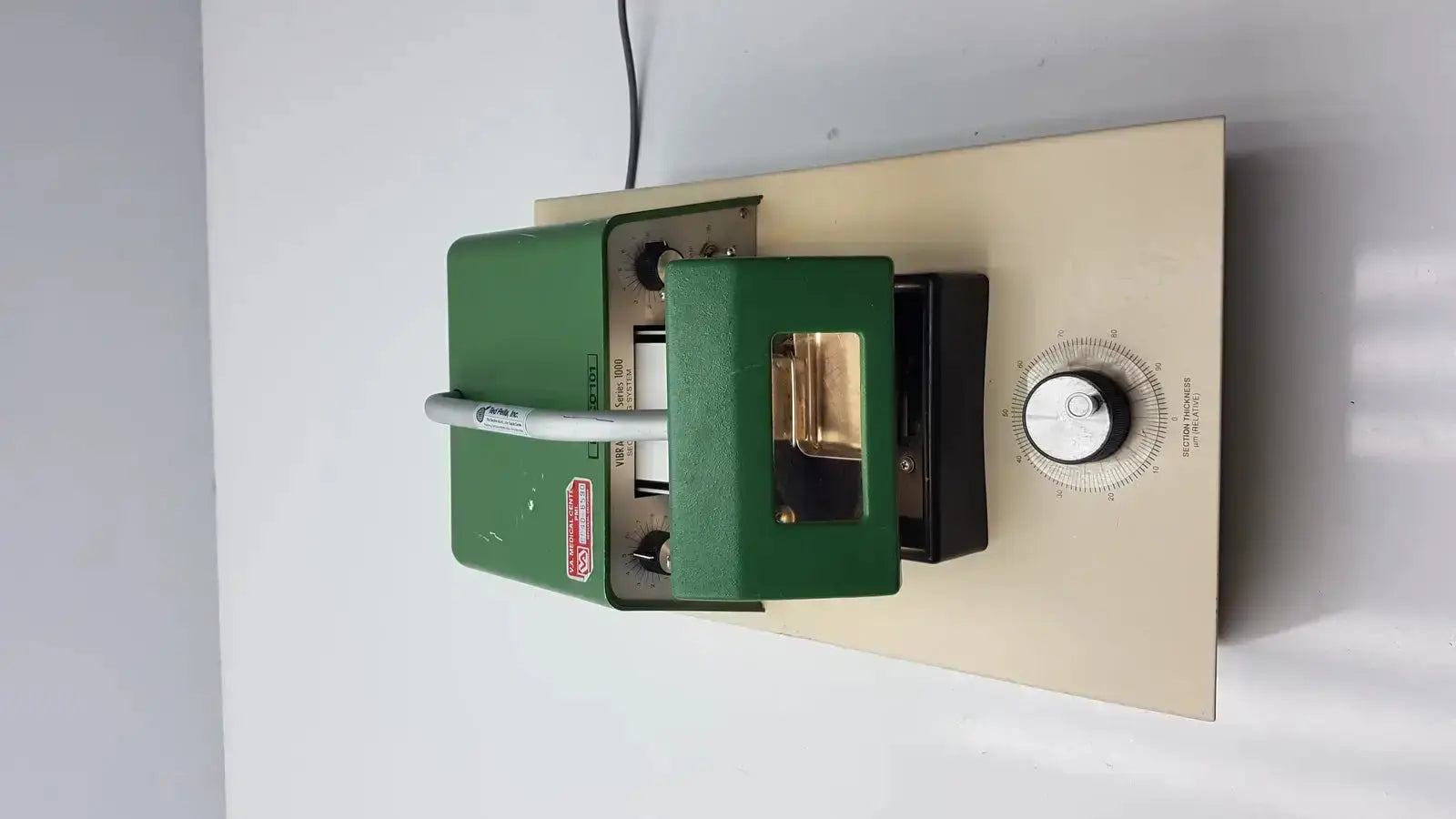 Green metal tpi vibratome series 1000 sectioning system with beige base and rotary dial for precise tissue slicing