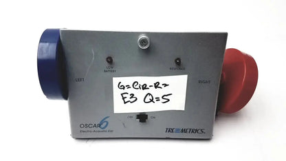Gray metal tremetrics oscar 6 electro-acoustic ear device with blue and red attachments for used medical equipment sale