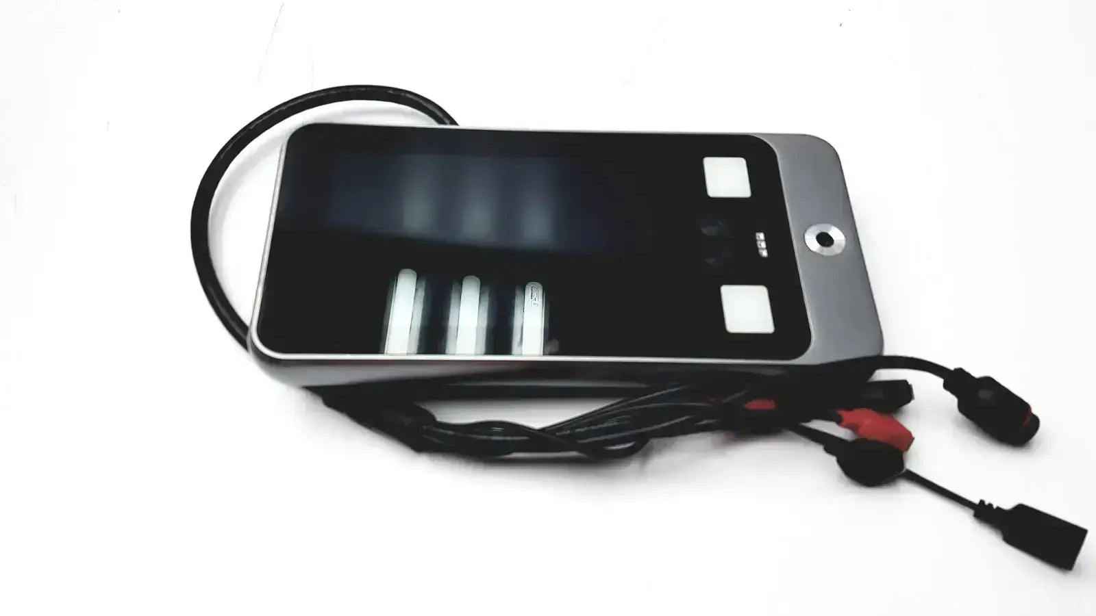 Black and silver Turing body temperature thermal scanner with screen and buttons connected by red and black cables