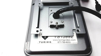 Silver metal mounting bracket with black cable attached to the back of turing body temperature thermal scanner model tvts-op-btts 7-g2