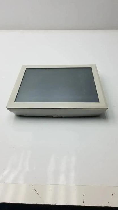 Beige rectangular touchscreen monitor with sleek minimalist design by Tyco Electronics for hospital surplus use