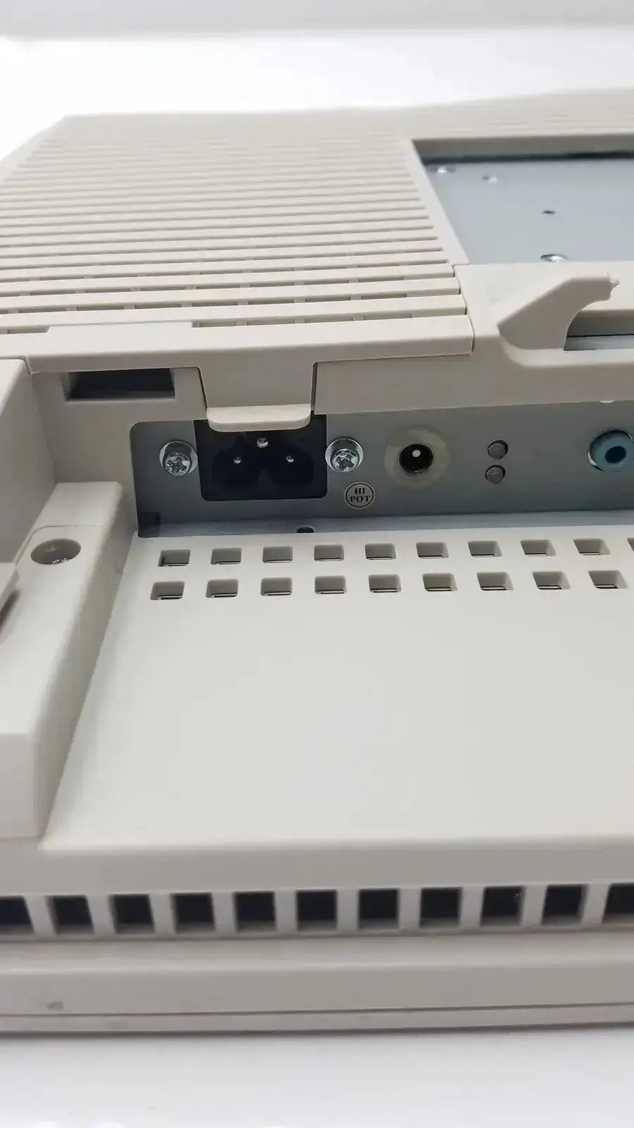 Beige plastic computer tower backside with power port and ventilation grilles for tyco electronics et1729l-7uwa-1-rtmd touchscreen monitor hospital surplus
