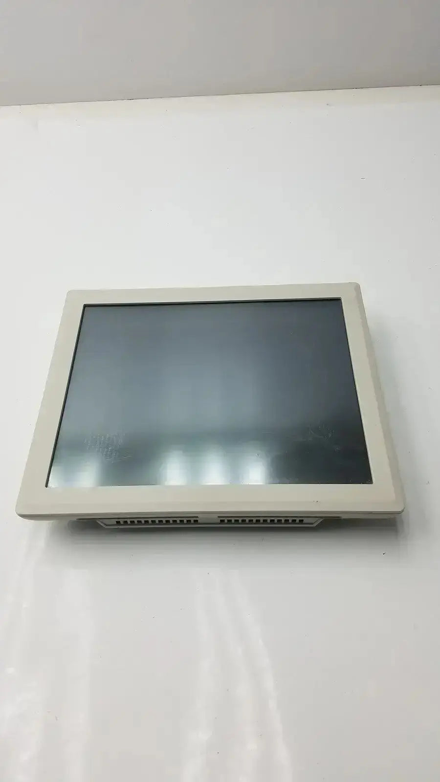 Beige tyco electronics touchscreen monitor with rectangular frame and dark screen from hospital surplus inventory