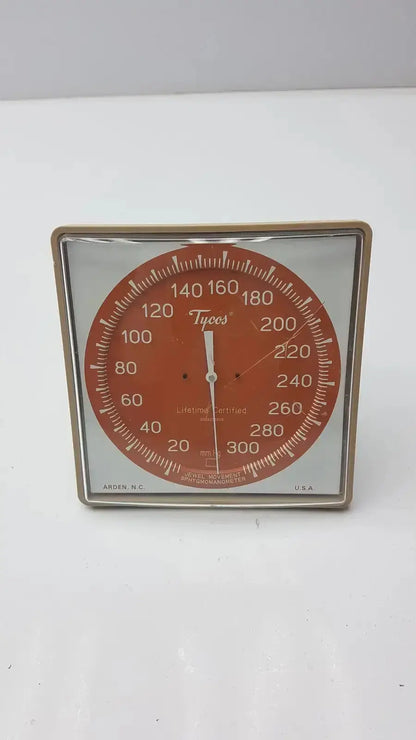 Vintage red and silver tycos lifetime certified jewel movement analog blood pressure monitor with metal frame