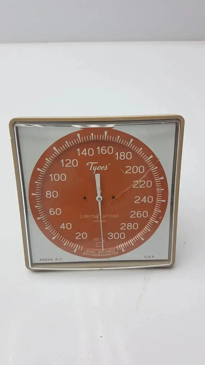 Vintage orange circular dial anemometer with metallic frame and white markings by arden n.c in certificate jewel movement sphygmomanometer
