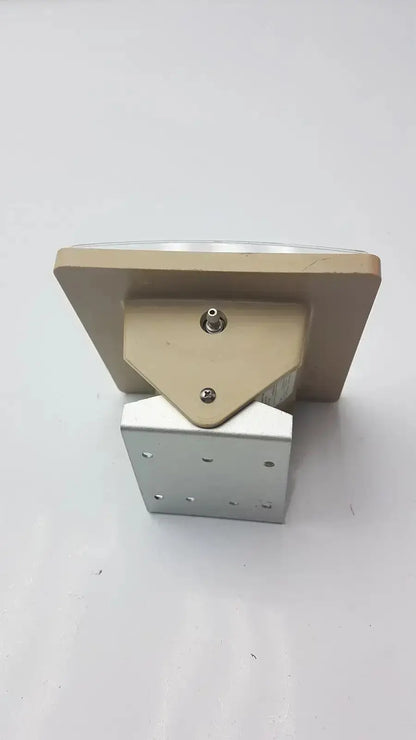 Beige rectangular wall-mounted display stand with silver metal base for tycos lifetime certified jewel movement sphygmomanometer