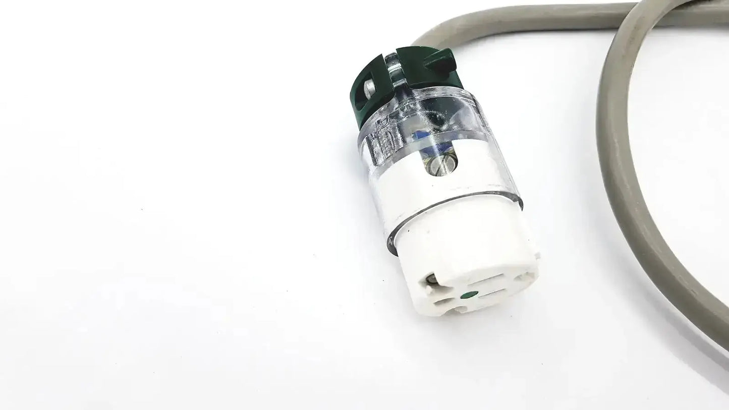 Clear plastic and white ul standard outdoor mini extension cord plug with green safety cap and three-pronged design