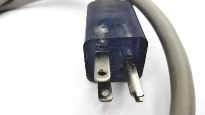 Blue plastic electrical plug with metallic prongs and gray cord for ul standard outdoor mini extension cord