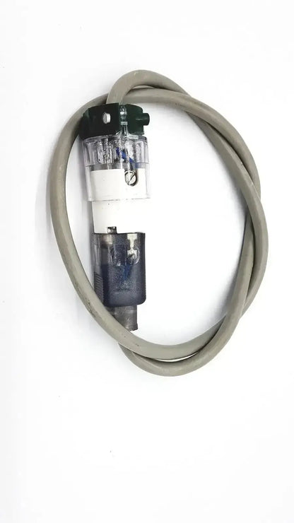 Gray coiled standard outdoor mini extension cord with transparent cylindrical filter housing and black capped top