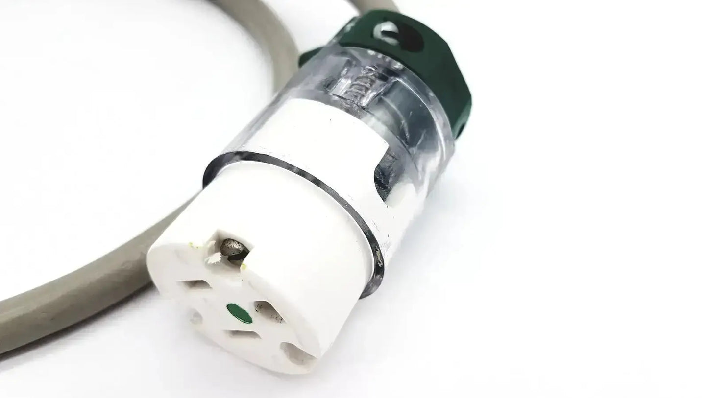 White and green ul standard outdoor mini extension cord plug with transparent housing and metallic contacts inside