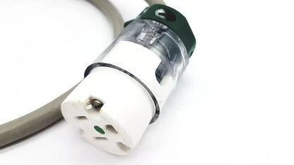 White and green ul standard outdoor mini extension cord plug with transparent housing and metallic contacts inside
