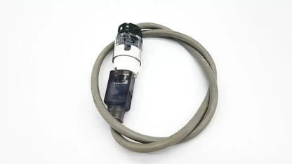 Gray coiled ul standard outdoor mini extension cord with black and transparent plastic connector housing