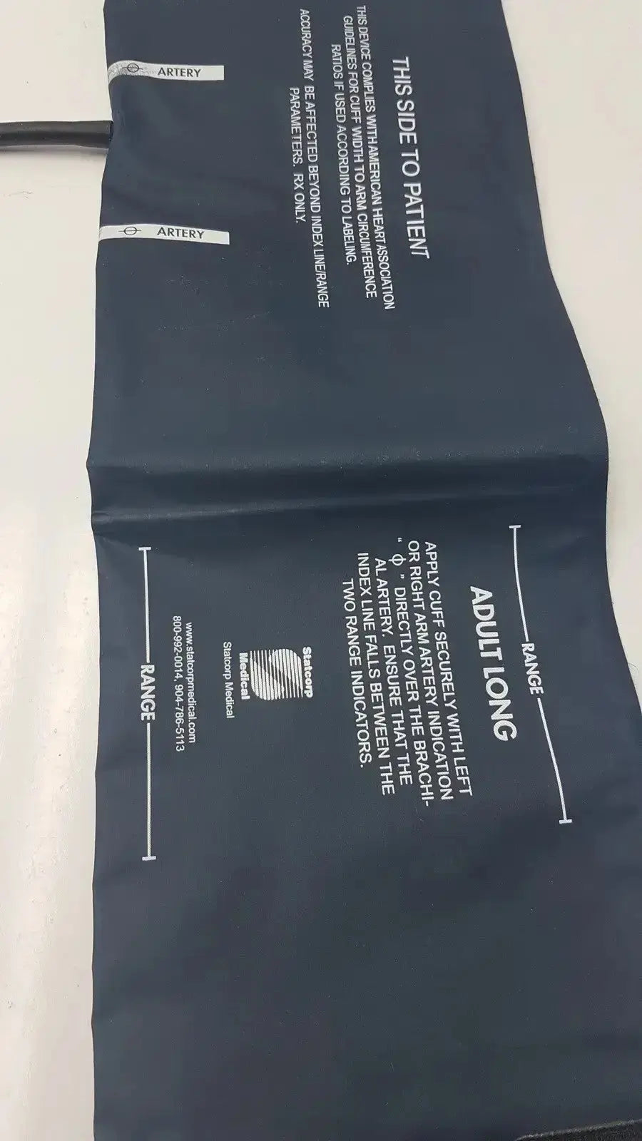 Dark blue adult-sized Ultra Check blood pressure cuff with white printed instructions and branding for accurate blood pressure