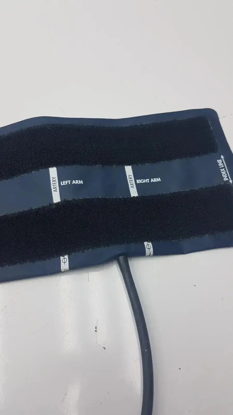 Navy blue ultra check blood pressure cuff u2635 with white printed labels for left arm right arm and artery line pressure cuff