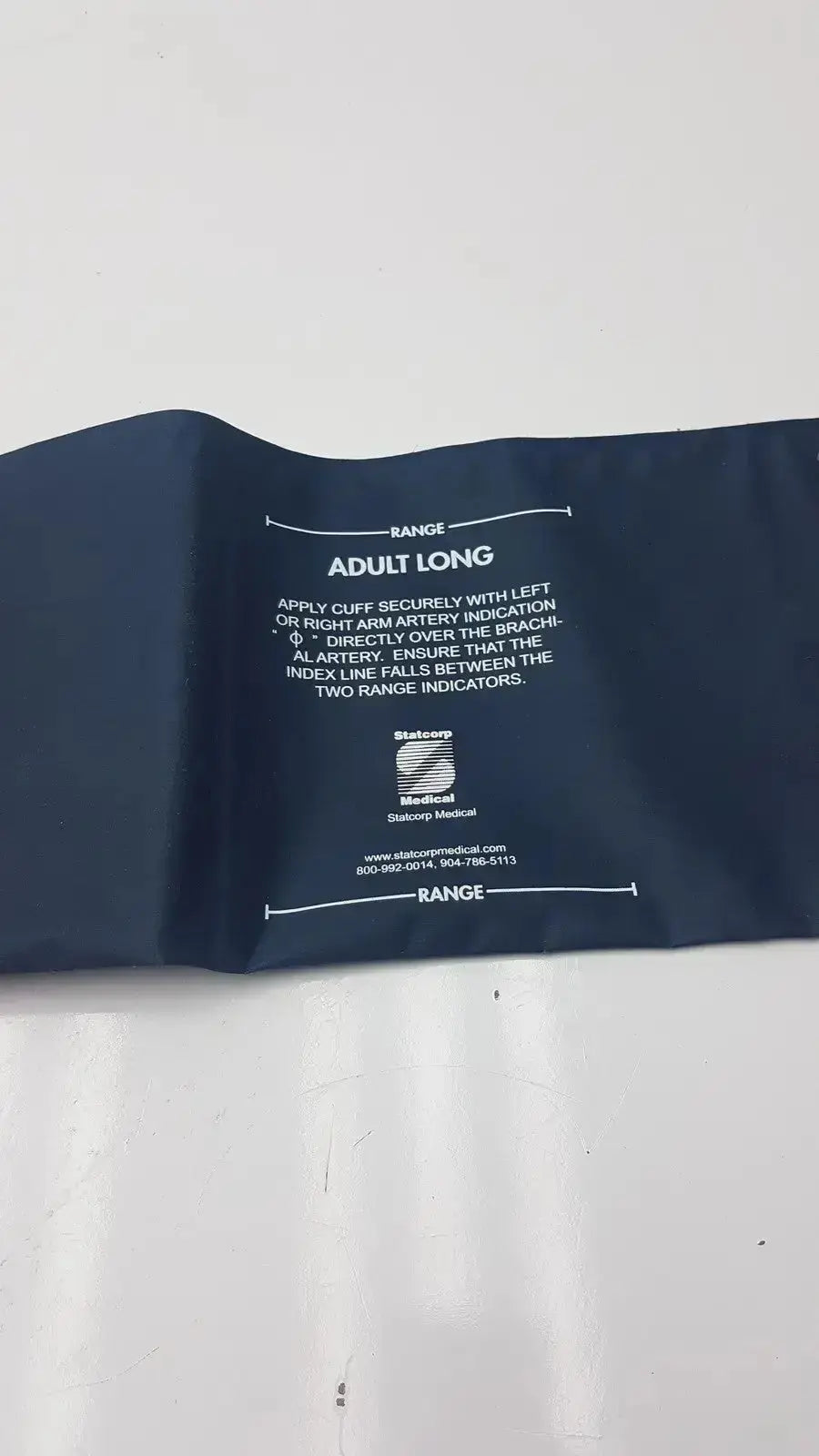 Dark blue ultra check blood pressure cuff u2635 with white printed instructions and brand logo for accurate blood pressure measurement