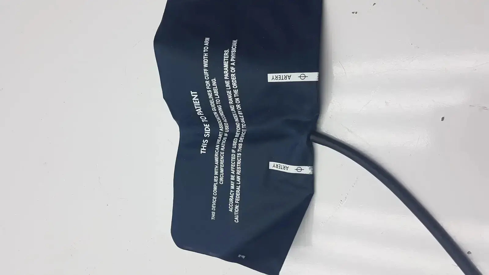 Navy blue ultra check blood pressure cuff u2635 latex free with black tubing and white printed instructions for blood pressure use