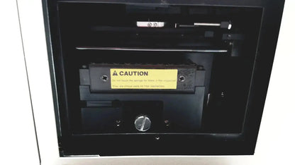 Black industrial-grade printer cartridge with yellow caution label and metallic fasteners for ultramark bio-rad microplate imaging system