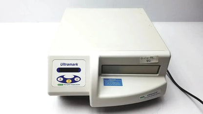 Off-white plastic Ultramark Bio-Rad microplate imaging system with control panel featuring blue and yellow buttons