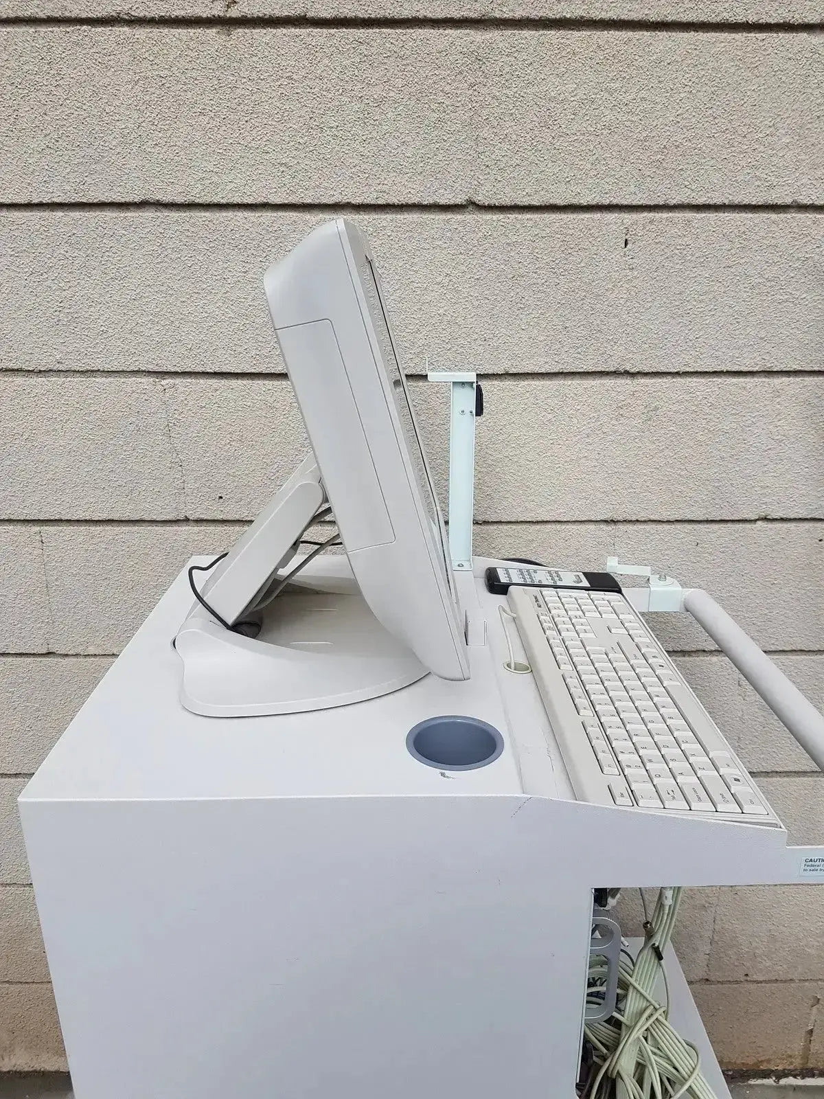 White all-in-one computer with integrated monitor and keyboard on white stand for multilab series ii lhs vascular cart