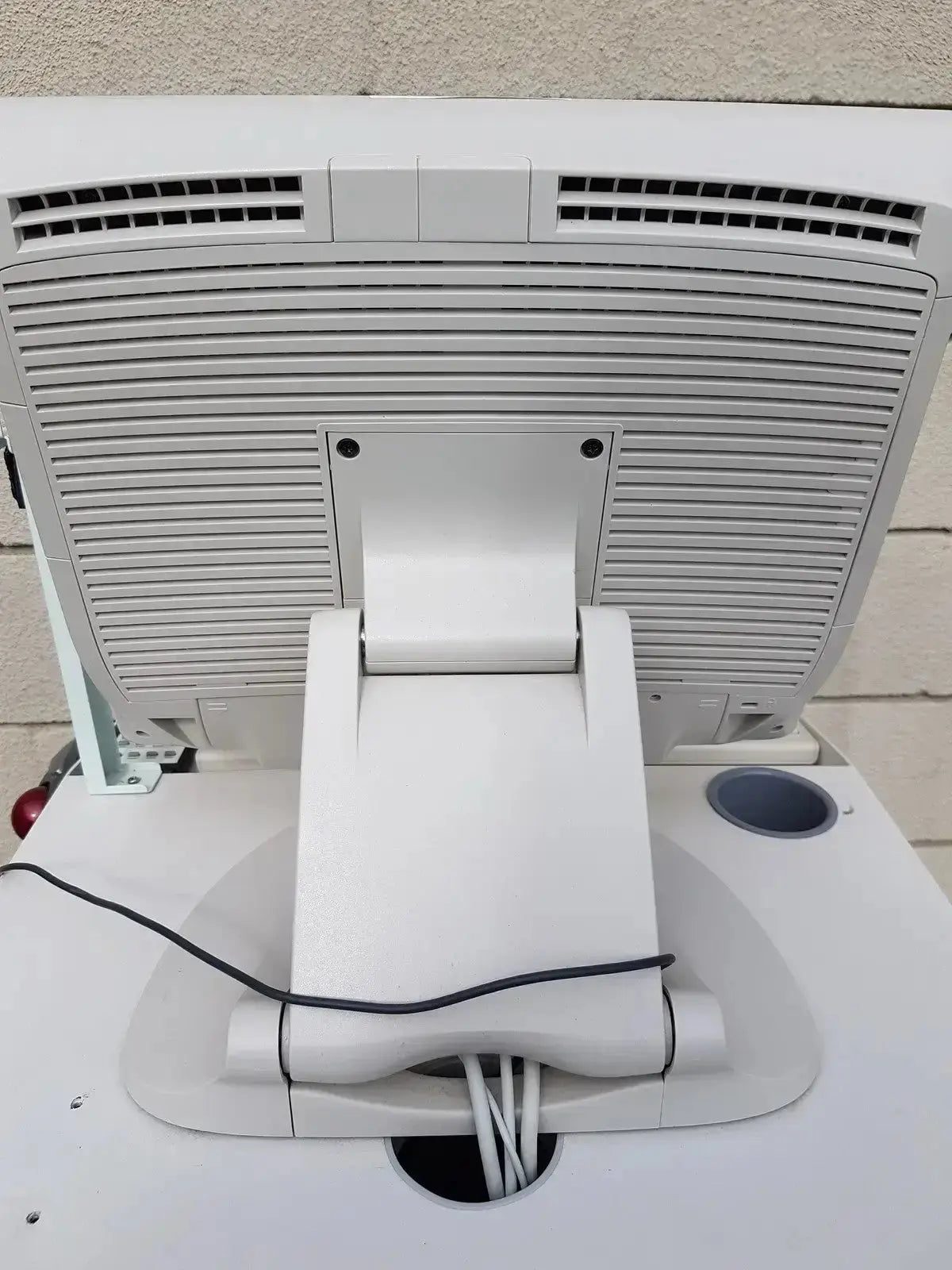 White plastic cash register with built-in display and cable management on the multilab series ii lhs vascular cart