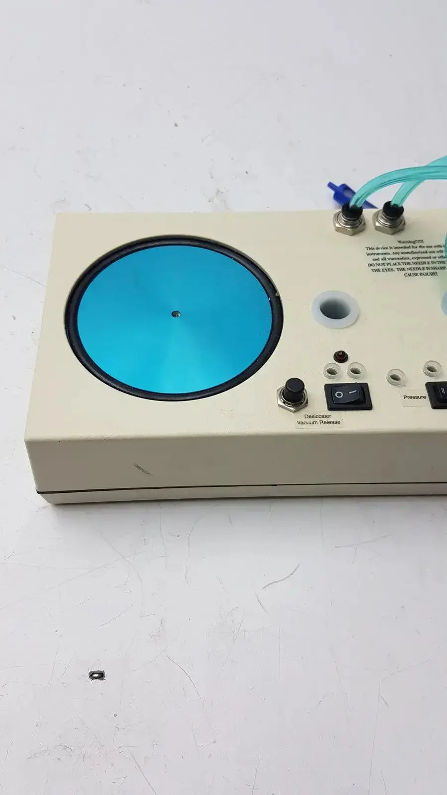 Beige unicorn medical md11684 desiccator vacuum system with circular blue glass plate and multiple control knobs and ports