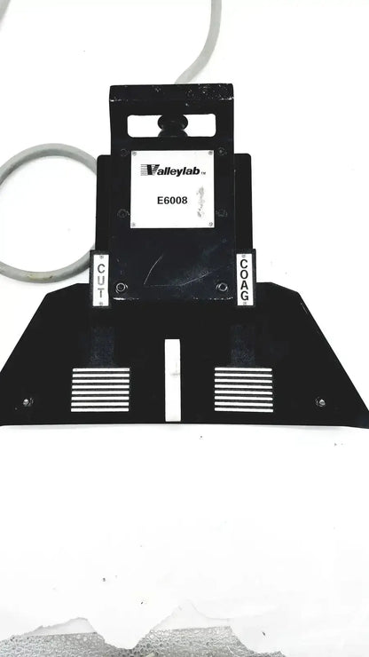 Black valleylab covidien e6008 electrosurgical monopolar footswitch with labeled cut and coat sections for precise control
