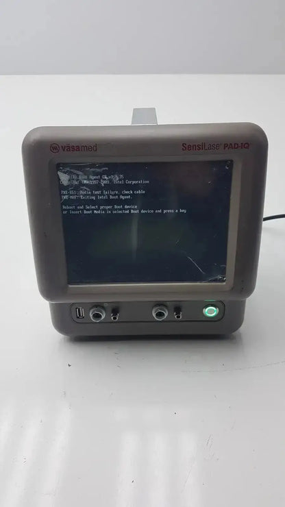 Gray plastic vasamed sensilase pressure testing monitor with cracked screen displaying diagnostic text pad-10