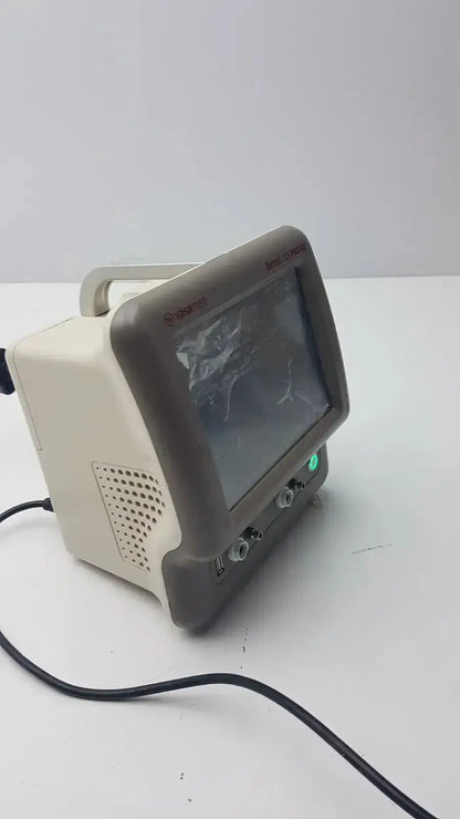 Beige and gray vasamed sensilase pressure testing monitor with small screen ventilation grille and control knobs