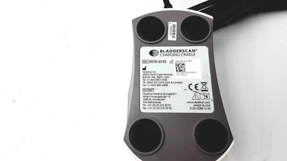 Gray and white Verathon 0570-0155 bladderScan charging cradle with black circular contact points for bladderScan charging