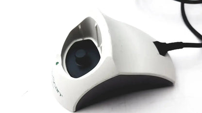 White and black ergonomic mouse with curved design and logitech branding used with bladderscan charging cradle