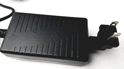 Black plastic textured power adapter with two-prong plug for verathon 0570-0155 bladderscan charging cradle